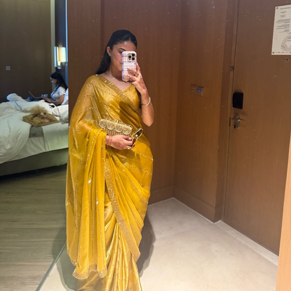 Elegant Yellow Saree with Gold Accents